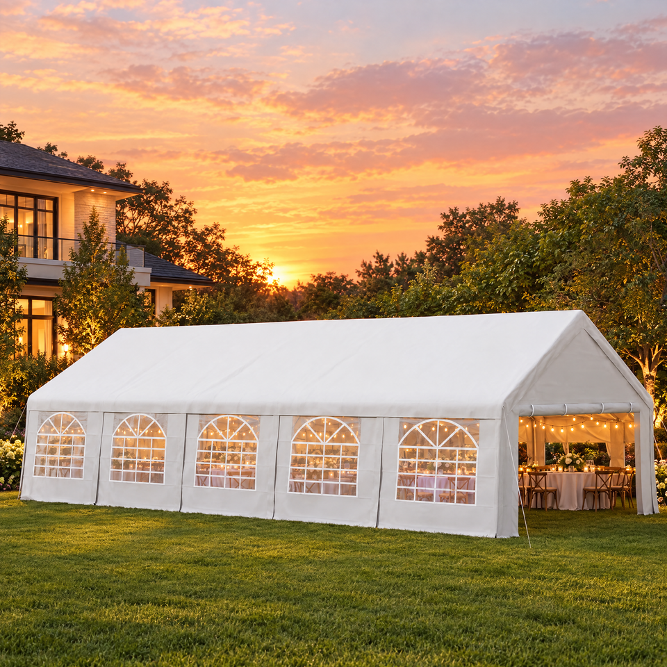 White party tent set up for an evening garden party