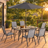 Patio dining set on a backyard deck set for dinner