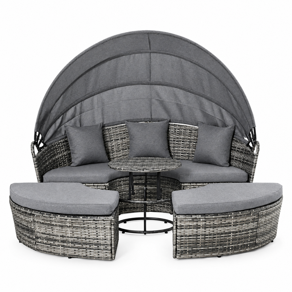 Wicker patio daybed sofa set with retractable canopy on white background